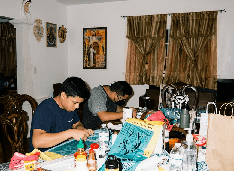 The two Milunova founders hand-assembling Stop & Go at a table