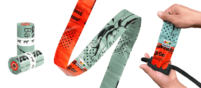 A roll of green Stop & Go poop bags ending in 3 red warning bags that signal the roll is running out